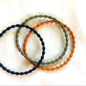 Trio of springy metallic bracelets